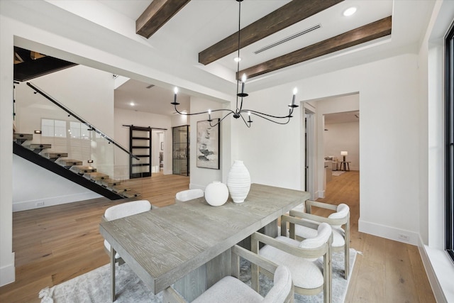 431 W 30th St, Houston, TX 77018 - dining room featuring a chandelier, stairway, beam ceiling, and light wood-style floors