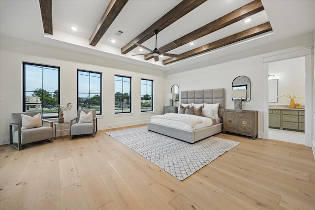 431 W 30th St, Houston, TX 77018 - bedroom featuring light wood-style flooring, multiple windows, beam ceiling, and ensuite bath