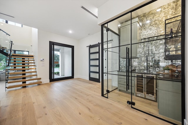 431 W 30th St, Houston, TX 77018 - wine room with wood finished floors, healthy amount of natural light, wine cooler, and recessed lighting
