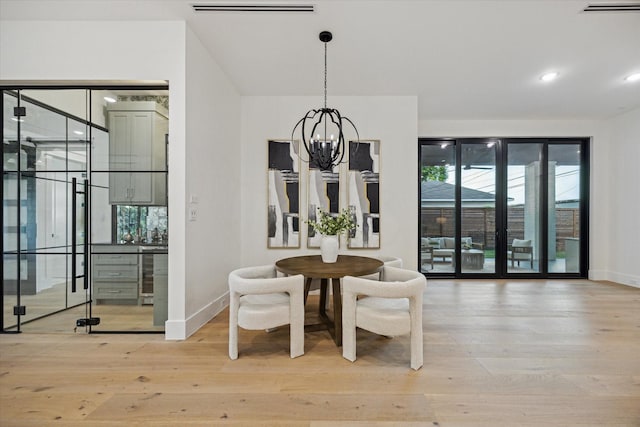 431 W 30th St, Houston, TX 77018 - dining room featuring wood finished floors, a chandelier, and recessed lighting
