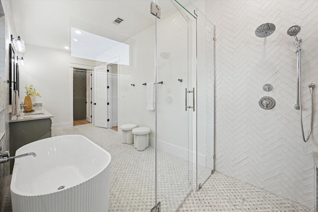 431 W 30th St, Houston, TX 77018 - full bathroom with a shower stall, a freestanding bath, vanity, and recessed lighting