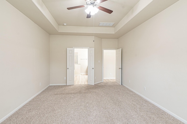 19022 Summer Farm Trl, Richmond, TX 77407 - unfurnished bedroom with a raised ceiling, light colored carpet, and a ceiling fan
