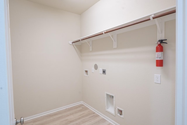 19022 Summer Farm Trl, Richmond, TX 77407 - washroom featuring electric dryer hookup, washer hookup, and light wood-type flooring