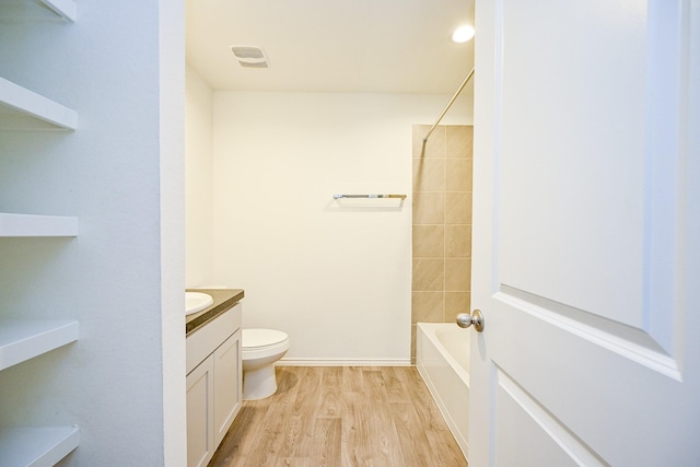 5411 Auburn Gardens Ct, Spring, TX 77373 - full bath with vanity, wood finished floors, and shower / tub combination