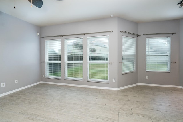 20027 Bayliss Manor Ln, Cypress, TX 77433 - spare room with baseboards and ceiling fan