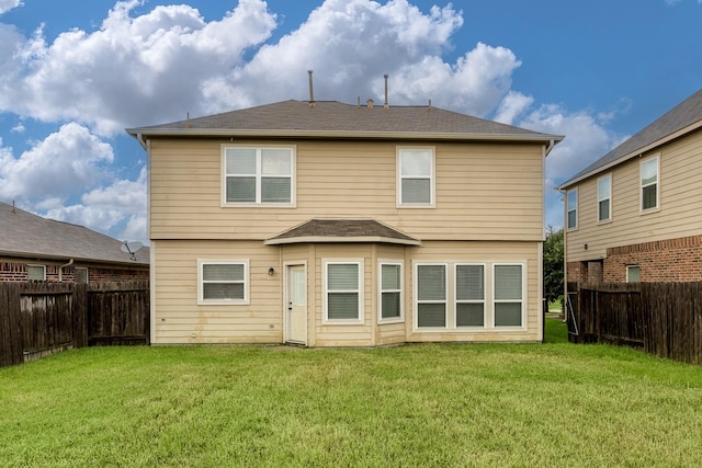 20027 Bayliss Manor Ln, Cypress, TX 77433 - rear view of house with a fenced backyard and a shingled roof