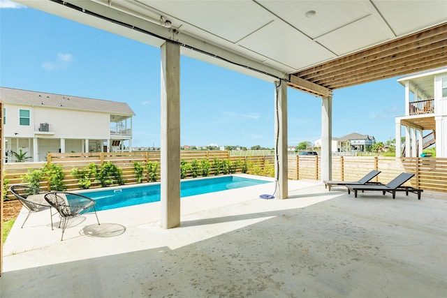 2401 103rd St, Galveston, TX 77554 - view of swimming pool featuring a patio area and a fenced backyard
