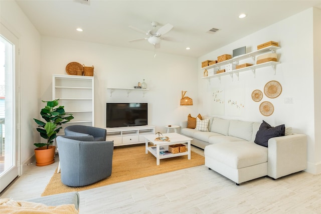 2401 103rd St, Galveston, TX 77554 - living room with ceiling fan, recessed lighting, and light wood-type flooring