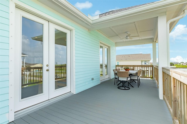 2401 103rd St, Galveston, TX 77554 - deck featuring french doors, outdoor dining space, and a ceiling fan