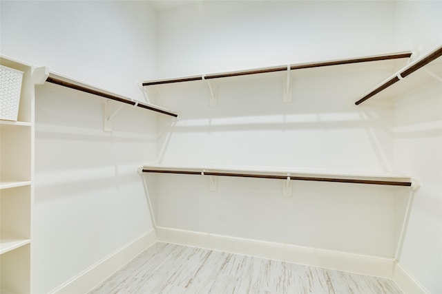 2401 103rd St, Galveston, TX 77554 - spacious closet with light wood-style floors