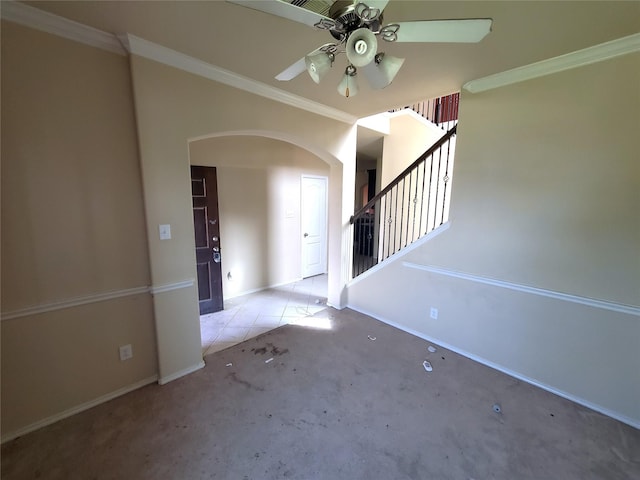 2714 Glenfield Manor Ln, Houston, TX 77014 - carpeted entryway with arched walkways, ceiling fan, stairs, and crown molding