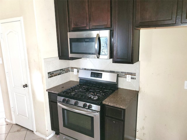 2714 Glenfield Manor Ln, Houston, TX 77014 - kitchen featuring appliances with stainless steel finishes, tasteful backsplash, and dark brown cabinetry