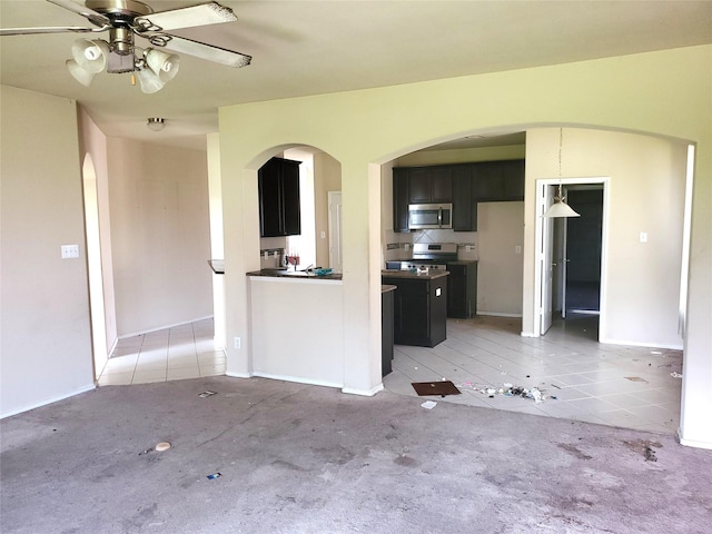 2714 Glenfield Manor Ln, Houston, TX 77014 - unfurnished living room featuring arched walkways, ceiling fan, light tile patterned floors, and light carpet