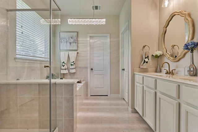 135 Forest Heights Way, Montgomery, TX 77316 - full bathroom with double vanity, a garden tub, tile patterned floors, and a tile shower