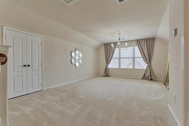 135 Forest Heights Way, Montgomery, TX 77316 - empty room with vaulted ceiling, carpet flooring, and a chandelier