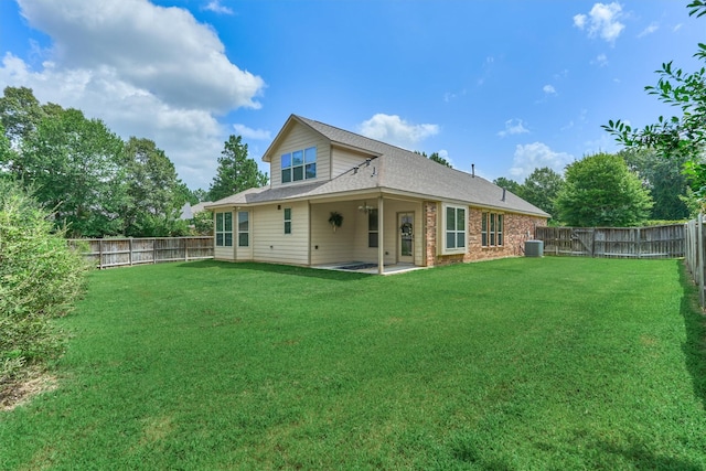 135 Forest Heights Way, Montgomery, TX 77316 - back of property featuring a fenced backyard, a patio, brick siding, and roof with shingles