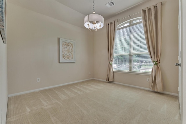 135 Forest Heights Way, Montgomery, TX 77316 - carpeted spare room featuring a chandelier and plenty of natural light