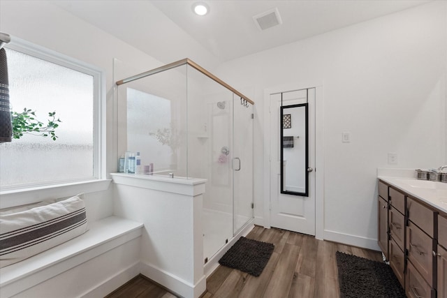 21635 Alberta Forest Cir, Magnolia, TX 77355 - full bathroom with wood finished floors, a stall shower, vanity, and recessed lighting