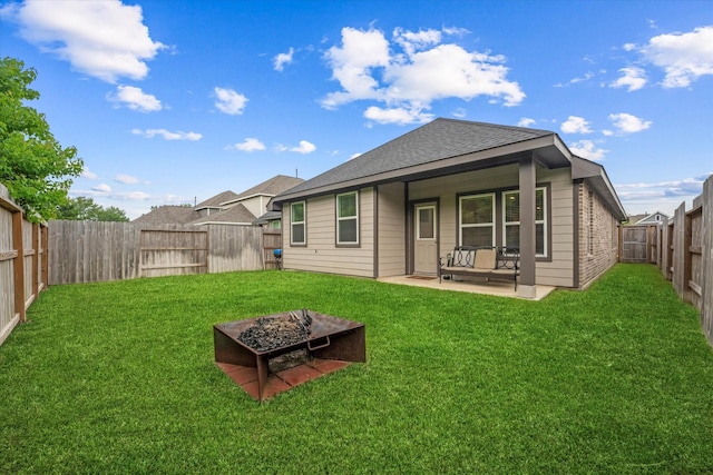 21635 Alberta Forest Cir, Magnolia, TX 77355 - back of property featuring a fire pit, a patio area, a fenced backyard, and roof with shingles
