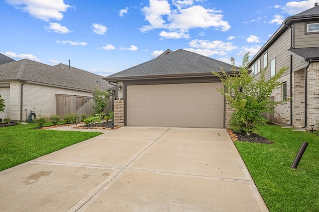 21635 Alberta Forest Cir, Magnolia, TX 77355 - view of front of property with brick siding, concrete driveway, a shingled roof, and a garage