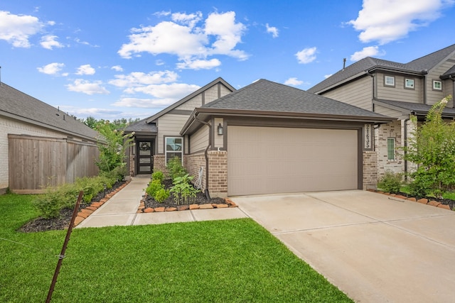 21635 Alberta Forest Cir, Magnolia, TX 77355 - view of front of property featuring brick siding, a garage, driveway, and a shingled roof