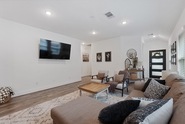 21635 Alberta Forest Cir, Magnolia, TX 77355 - living room with wood finished floors, recessed lighting, and vaulted ceiling