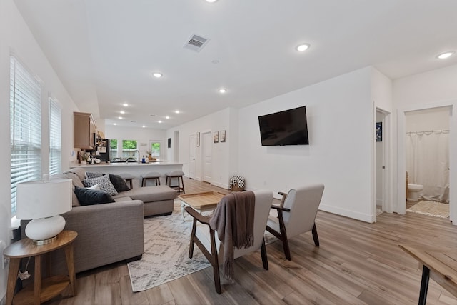 21635 Alberta Forest Cir, Magnolia, TX 77355 - living room featuring light wood finished floors and recessed lighting
