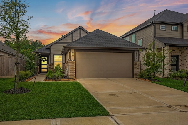 21635 Alberta Forest Cir, Magnolia, TX 77355 - view of front of home with brick siding, driveway, a garage, and a shingled roof