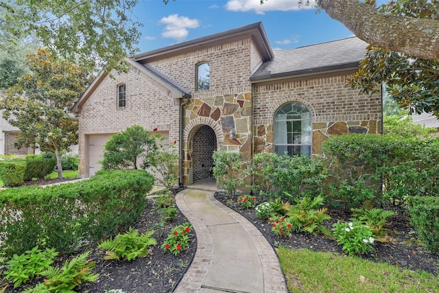 18415 Pin Oak Bend Dr, Cypress, TX 77433 - french country style house with brick siding, stone siding, a shingled roof, and a garage