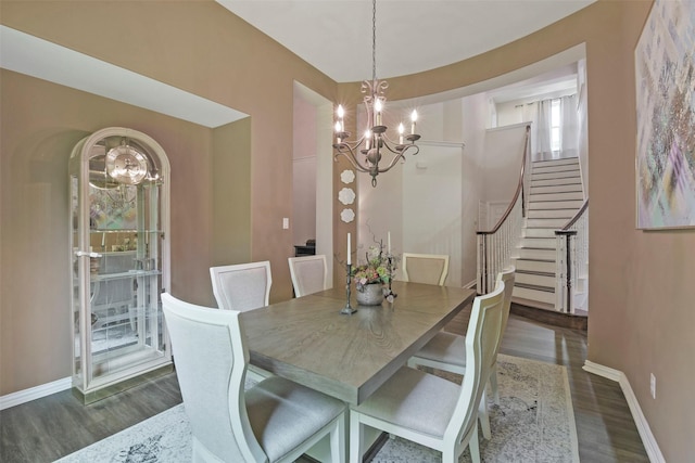 18415 Pin Oak Bend Dr, Cypress, TX 77433 - dining space featuring a chandelier, stairway, and wood finished floors