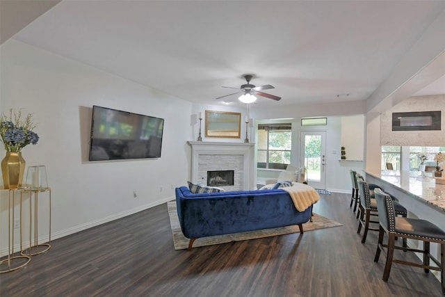 18415 Pin Oak Bend Dr, Cypress, TX 77433 - living room featuring dark wood-style floors, a stone fireplace, and ceiling fan