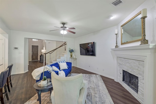 18415 Pin Oak Bend Dr, Cypress, TX 77433 - living room featuring stairway, a fireplace, wood finished floors, and a ceiling fan
