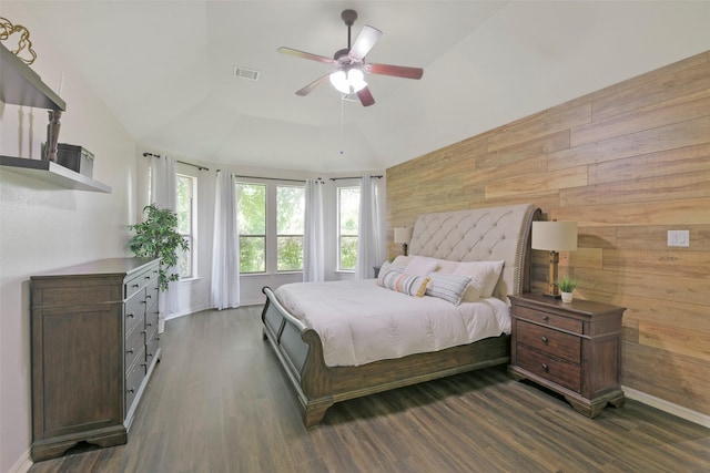 18415 Pin Oak Bend Dr, Cypress, TX 77433 - bedroom with wood finished floors, wooden walls, a tray ceiling, and ceiling fan