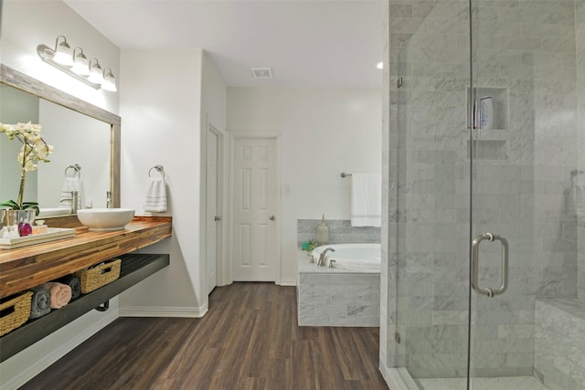18415 Pin Oak Bend Dr, Cypress, TX 77433 - bathroom with wood finished floors, a garden tub, a shower stall, and vanity