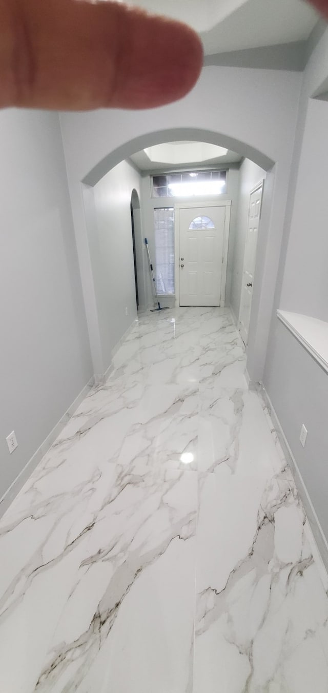 71 N Forrest Ave, La Porte, TX 77571 - corridor featuring arched walkways and light marble finish floors