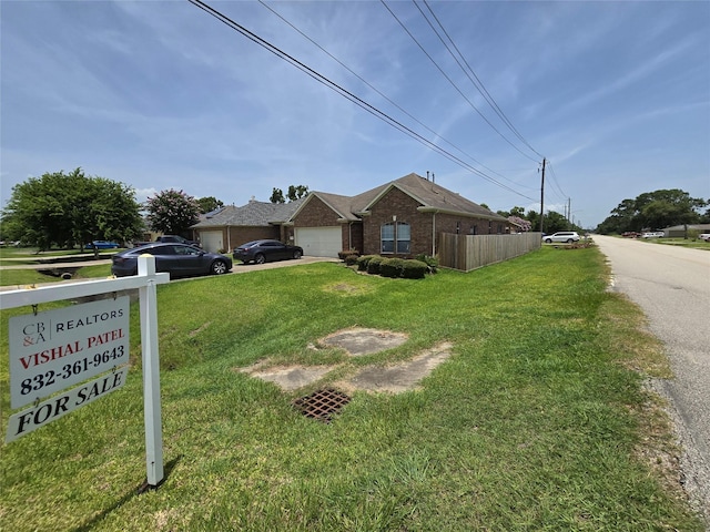 71 N Forrest Ave, La Porte, TX 77571 - view of front of property featuring brick siding, an attached garage, and driveway
