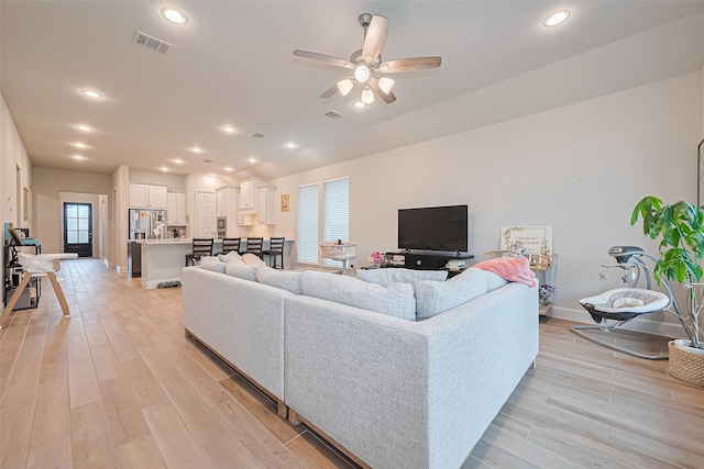 7522 Zion Grove Ct, Katy, TX 77493 - living room featuring a ceiling fan, light wood-style floors, and recessed lighting