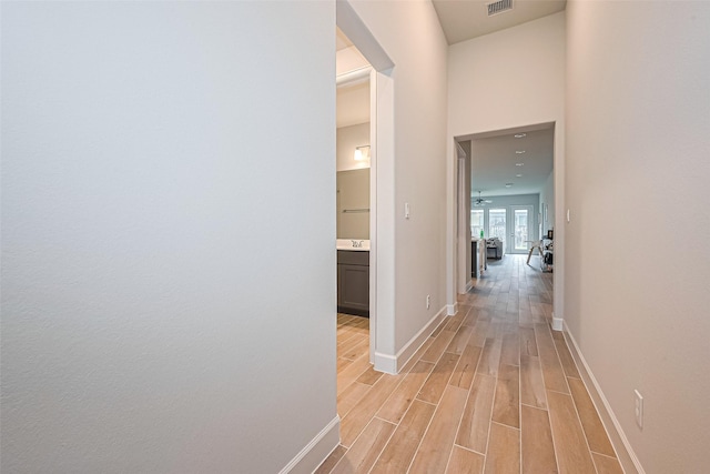 7522 Zion Grove Ct, Katy, TX 77493 - hallway featuring light wood-style floors and baseboards
