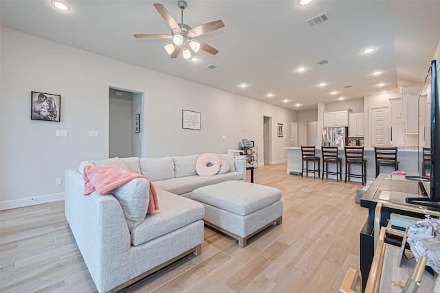 7522 Zion Grove Ct, Katy, TX 77493 - living room featuring a ceiling fan, light wood-type flooring, and recessed lighting