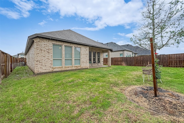 7522 Zion Grove Ct, Katy, TX 77493 - rear view of property with brick siding, a fenced backyard, and roof with shingles