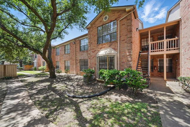 2255 Braeswood Park Dr Unit 181, Houston, TX 77030 - view of property with stairs and brick siding