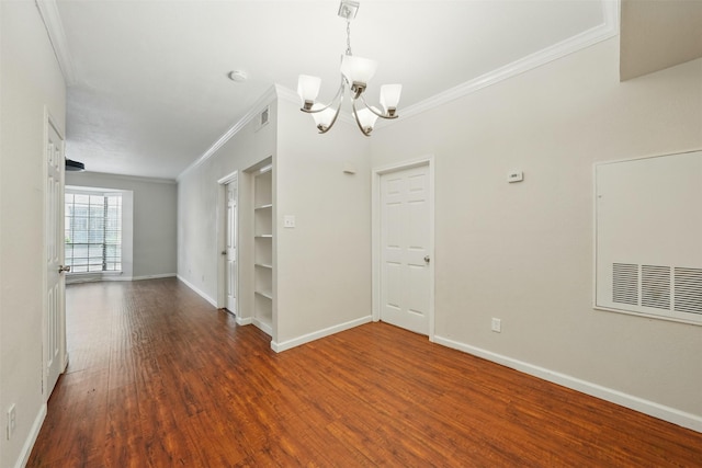 2255 Braeswood Park Dr Unit 181, Houston, TX 77030 - unfurnished room with ornamental molding, a chandelier, and wood finished floors
