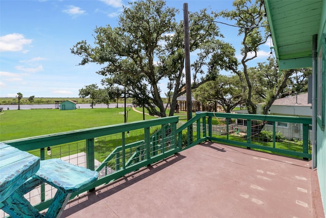 1040 County Road 206, Sargent, TX 77414 - view of patio / terrace featuring a water view and a shed