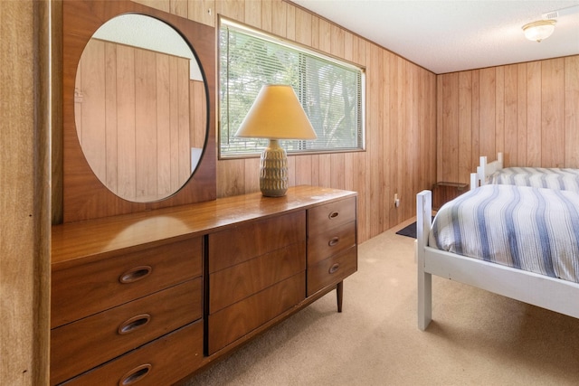 1040 County Road 206, Sargent, TX 77414 - bedroom with carpet floors and wood walls