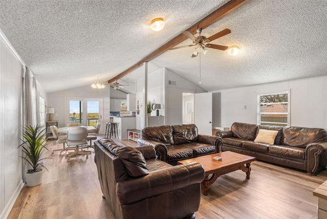 1040 County Road 206, Sargent, TX 77414 - living area featuring ceiling fan, a textured ceiling, healthy amount of natural light, and wood finished floors