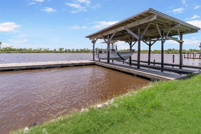 1040 County Road 206, Sargent, TX 77414 - dock featuring boat lift and a water view