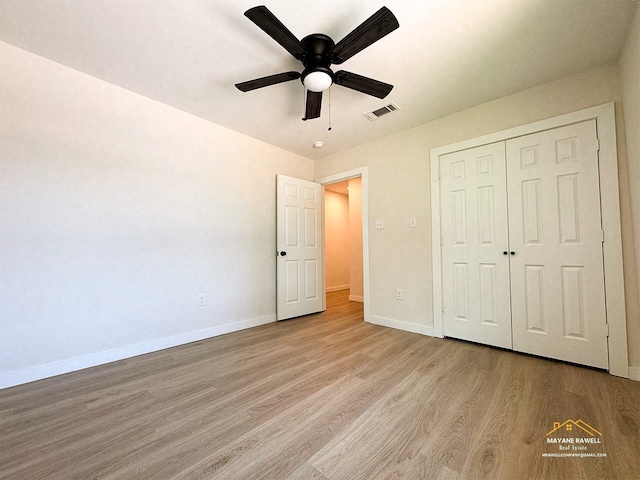 2630 34th St, Port Arthur, TX 77640 - unfurnished bedroom with light wood finished floors, a closet, and a ceiling fan