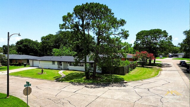 2630 34th St, Port Arthur, TX 77640 - view of front of house with driveway and a garage