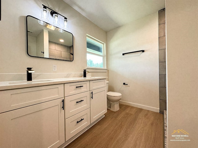 2630 34th St, Port Arthur, TX 77640 - full bath featuring wood finished floors and double vanity