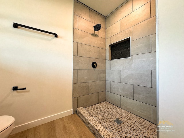 2630 34th St, Port Arthur, TX 77640 - bathroom with tiled shower and wood finished floors